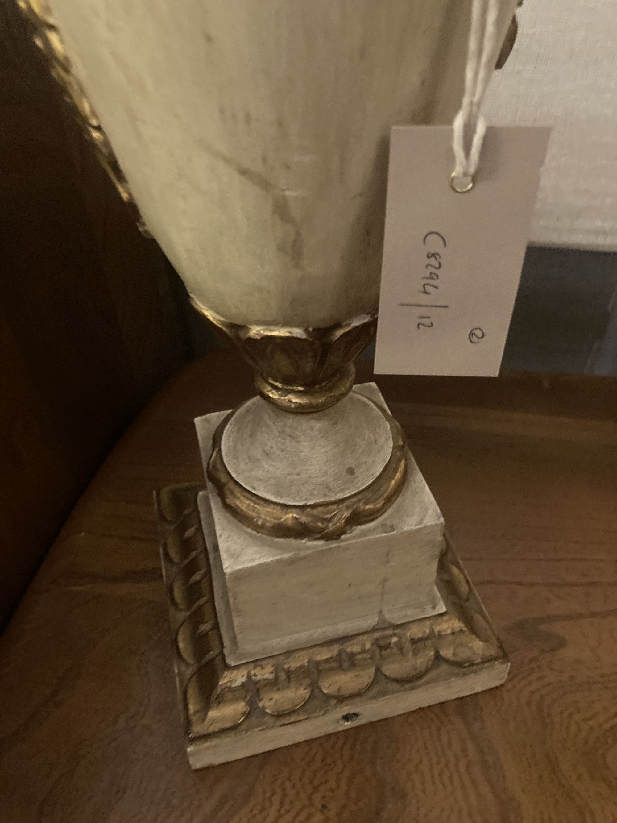 A brass table lamp with toleware shade, height 56cm, together with a parcel gilt painted wood table lamp